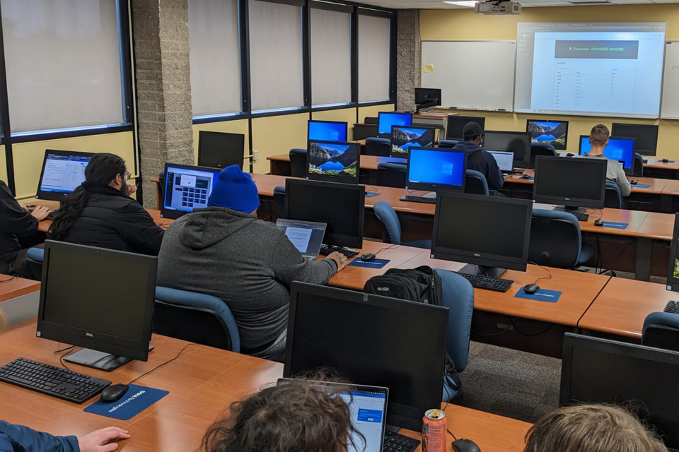 Classroon view of students competitng in a computer competition